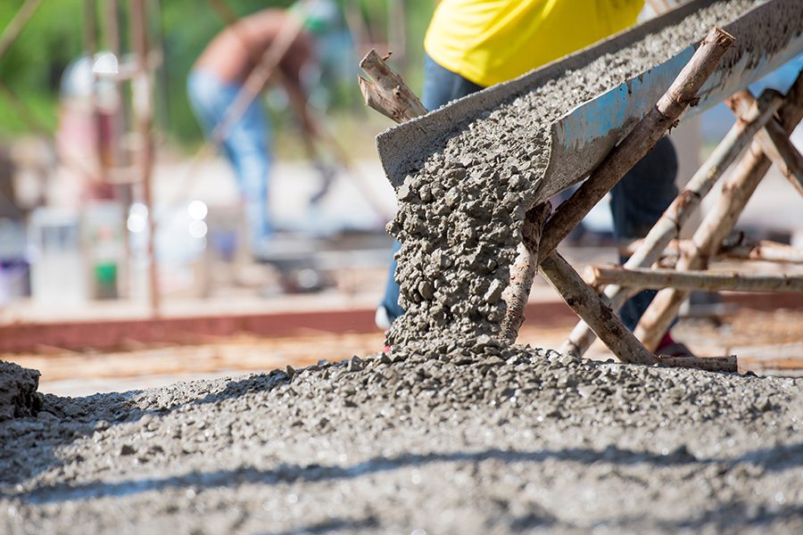 Concrete Contractor Insurance - Selective Focus of Concrete Pouring During Commercial Concreting of Floors for a Building